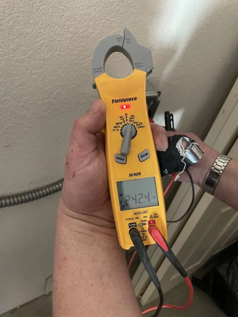 Voltage testing with clamp meter during Generator Installation in Milton